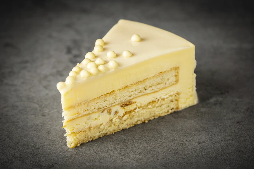 Raffaello Cake Slice - Decadent layers of white chocolate and coconut cream, ideal for a refined treat.