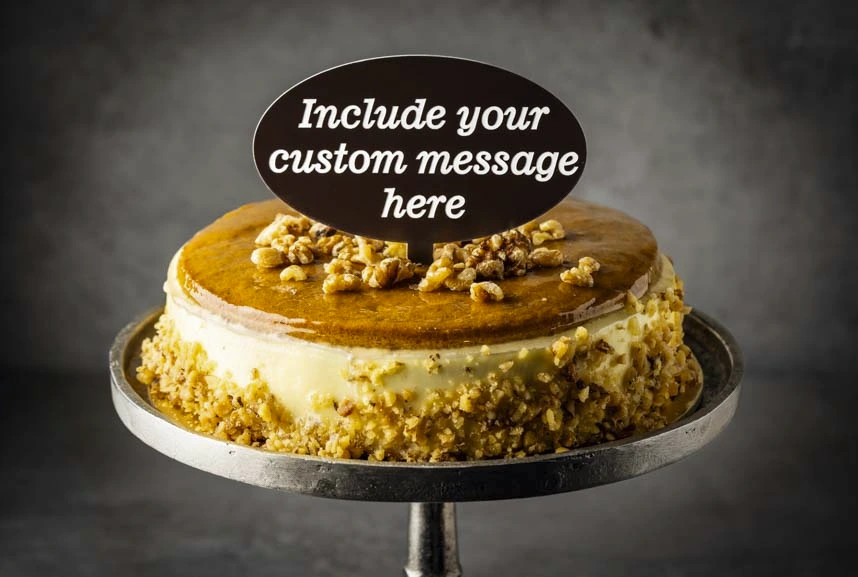 Carrot Cake with a custom message topper – a nutty, spiced carrot cake with cream cheese frosting and walnut garnish, personalised to suit any occasion.